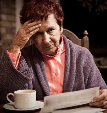 Woman looking worried about bills