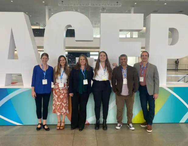 Institute team in front of ACEP sign